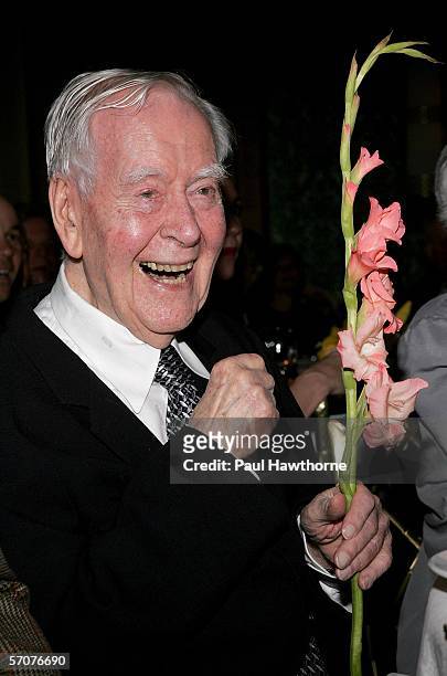 Playwright Horton Foote listens to actor Dame Edna read a poem as he is honored by the Signature Theatre Company on the eve of his 90th birthday at...