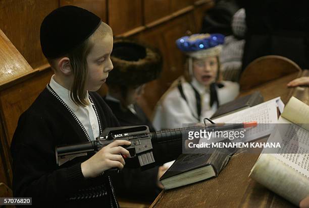 Ultra Orthodox Jews from the Wiznitz Hassidim group reads the Ester scrolls at the synagogue in the Israeli town of Beni Brak near Tel Aviv 13 March...
