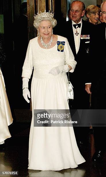 Her Majesty Queen Elizabeth II, followed by The Duke of Edinburgh Prince Philip, arrives for the Parliamentary dinner at Parliament House March 14,...