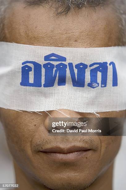 March 14: A man wears a blind fold that reads "Peaceful" as he joins tens of tousands of demonstrators seeking the resignation of Prime Minister...