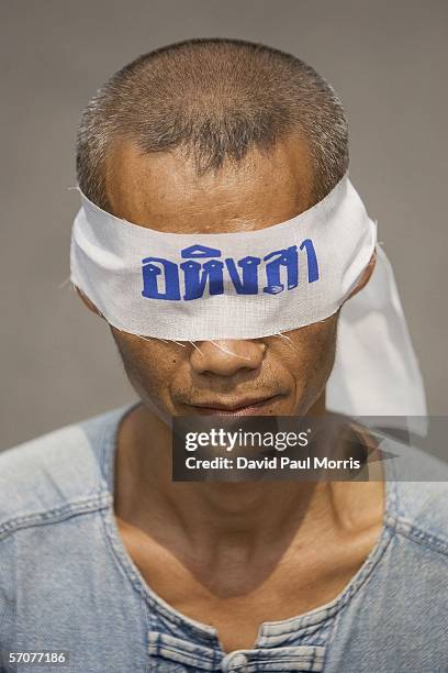 March 14: A man wears a blind fold that reads "Peaceful" as he joins tens of tousands of demonstrators seeking the resignation of Prime Minister...