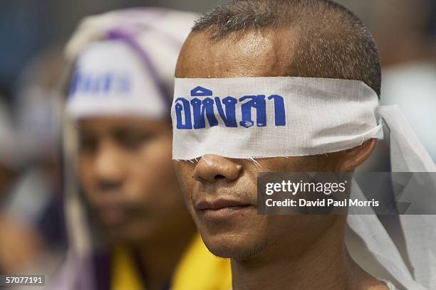March 14: A man wears a blind fold that reads "Peaceful" as he joins tens of tousands of demonstrators seeking the resignation of Prime Minister...