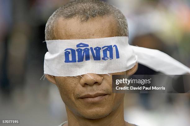 March 14: A man wears a blind fold that reads "Peaceful" as he joins tens of tousands of demonstrators seeking the resignation of Prime Minister...