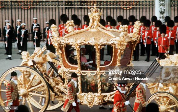 Queen Elizabeth II with Prince Philip, the Duke of Edinburgh in the Gold State Coach during the Queen's silver jubilee in London, 7th June 1977.