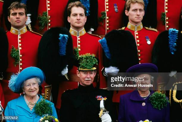 Queen Elizabeth ll with the Grand Duke Jean of Luxembourg and the Queen Mother with the Irish Guards at Chelsea on St. Patrick's Day in March of...