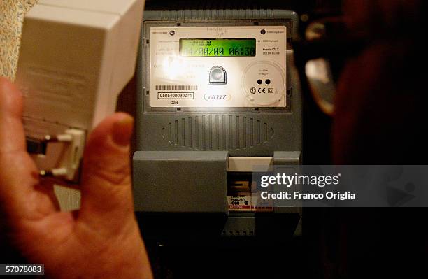 Man cheks his electricity meter, March 9 in Rome .