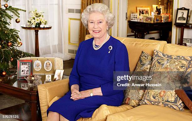 Queen Elizabeth II films her traditional Christmas broadcast to the Commonwealth from Buckingham Palace on December 19, 2001 in London, England.