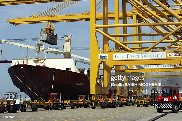 Dubai, UNITED ARAB EMIRATES: A cargo ship is docked at Jebel Ali port in Dubai 14 March 2006. Dubai Ports World, owned by the United Arab Emirates...