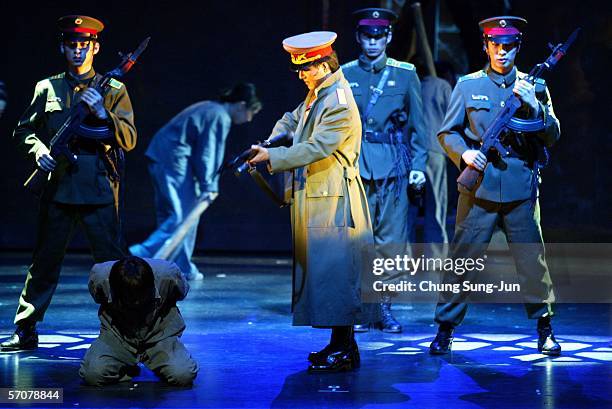 South Korean actors wearing North Korean military uniforms perform in the musical "Yoduk Story" produced by director Jung Sung-San who is a North...