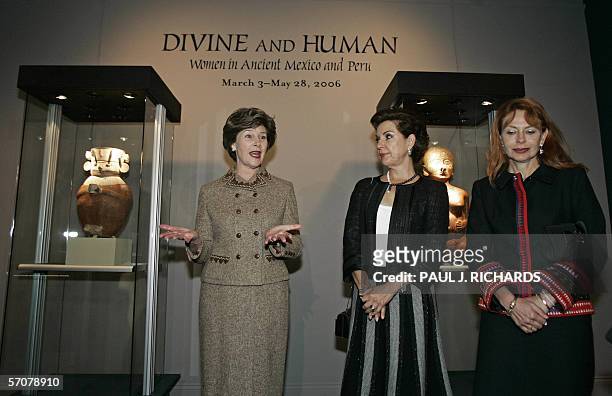 Washington, UNITED STATES: First Ladies Laura Bush, Marta Sahagun de Fox , and Eliane Karp de Toledo make remarks during a personal tour of "Divine...