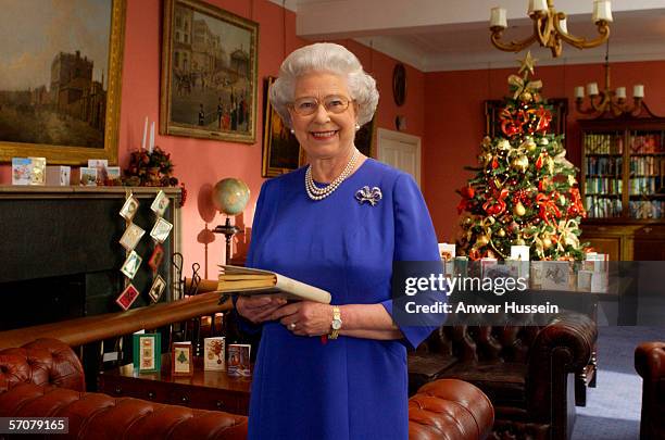 Queen Elizabeth II films her traditional Christmas broadcast to the Commonwealth from Buckingham Palace on December 19, 2001 in London, England.