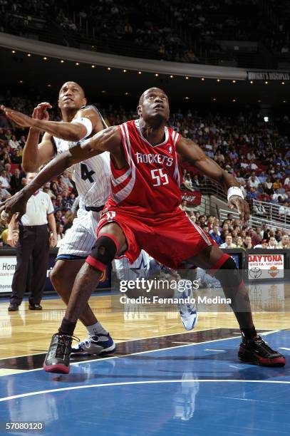 February 26: Dikembe Mutombo of the Houston Rockets boxes out against Tony Battie of the Orlando Magic February 26, 2006 at TD Waterhouse Centre in...