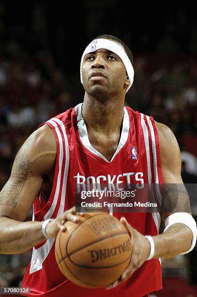 February 26: Tracy McGrady of the Houston Rockets holds the ball as he prepares to attempt a free throw against the Orlando Magic February 26, 2006...