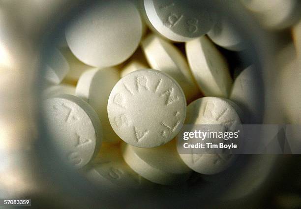 Generic aspirin lie inside its bottle March 14, 2006 in Des Plaines, Illinois. A new study reportedly states that there may risks in combining the...