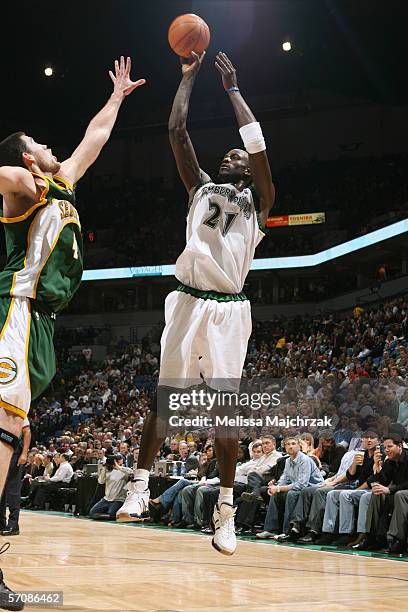 Kevin Garnett of the Minnesota Timberwolves shoots a jump shot against Nick Collison of the Seattle SuperSonics during the game at the Target Center...