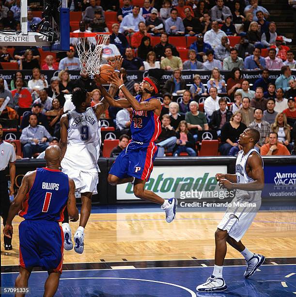Richard Hamilton of the Detroit Pistons takes the ball to the basket against DeShawn Stevenson of the Orlando Magic during the game at TD Waterhouse...