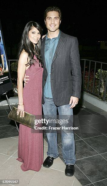 Actress Roselyn Sanchez poses with Eric Winter,actor attends the Premiere Of "Cayo" at the Harmoney Gold Theatre on March 14, 2006 in Los Angeles,...