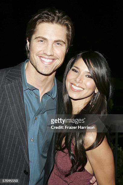 Actress Roselyn Sanchez poses with Eric Winter,actor attends the Premiere Of "Cayo" at the Harmoney Gold Theatre on March 14, 2006 in Los Angeles,...