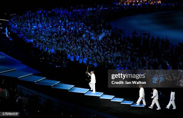 Governor of Victoria John Landy is followed by Marjorie Jackson-Nelson Governor of South Australia, Ron Clarke Mayor of the Gold Coast and Cathy...