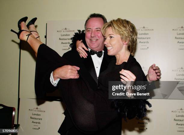 Presenter Michael Barrymore lifts up TV presenter Mary Nightingale at the Moet & Chandon Carlton TV London Restaurant Awards at the Grosvenor House...