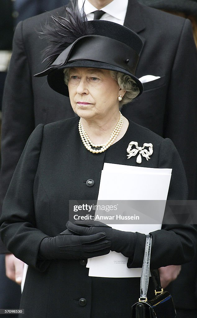 GBR: Queen Elizabeth II watches the Queen Mother's coffin being driven from Westminster Abbey