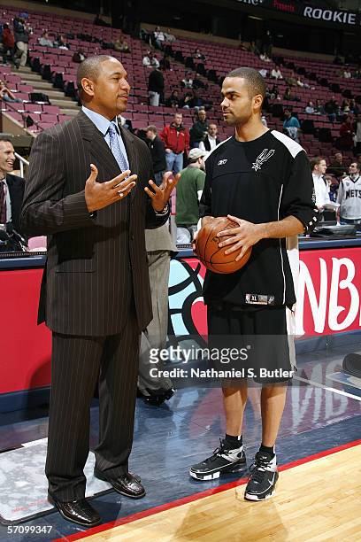 Former player and current YES Network commentator Mark Jackson talks to Tony Parker of the San Antonio Spurs before the game against the New Jersey...
