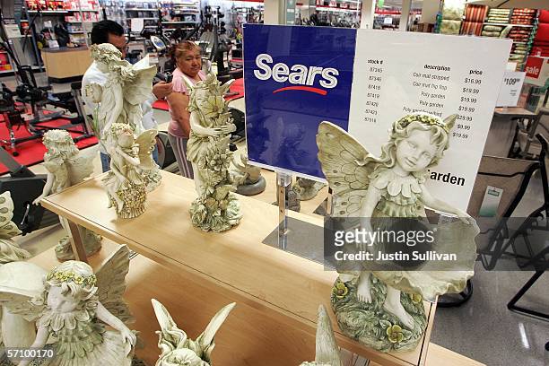 Customers at a Sears store shop in the home and garden section March 15, 2006 in San Bruno, California. Sears Holdings Corp. Announced a...