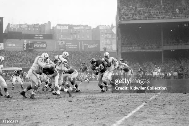 Runningback Mel Triplett, of the New York Giants, runs the ball during the NFL Championship Game on December 28, 1958 against the Baltimore Colts at...