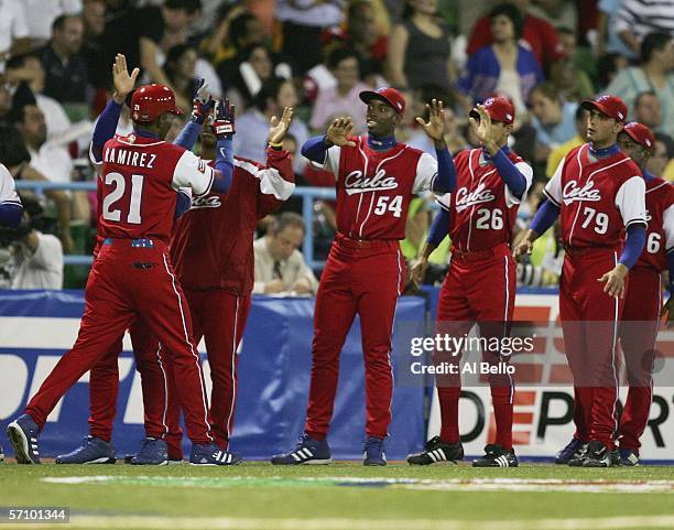 Alexei Ramirez of Cuba celebrates after scoring against Puerto Rico during Round 2 of the World Baseball Classic on March 15, 2006 at Hiram Bithorn...