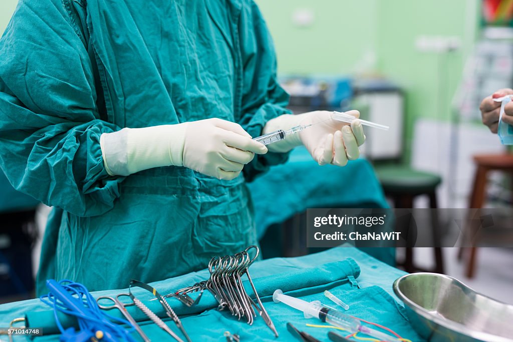 Scrub Instruments Scrub Nurse Preparing Surgical Instruments For Surgery High-Res Stock ...