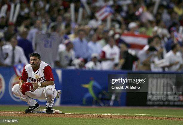 Jose Valentin of Puerto Rico rests on a base during a pitching change for Cuba during Round 2 of the World Baseball Classic on March 15, 2006 at...