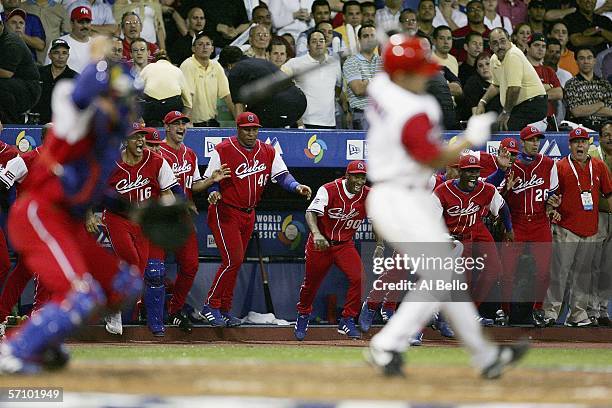 Cuban players celebrate after Ivan Rodriguez of Puerto Rico strikes out to end their game during Round 2 of the World Baseball Classic on March 15,...