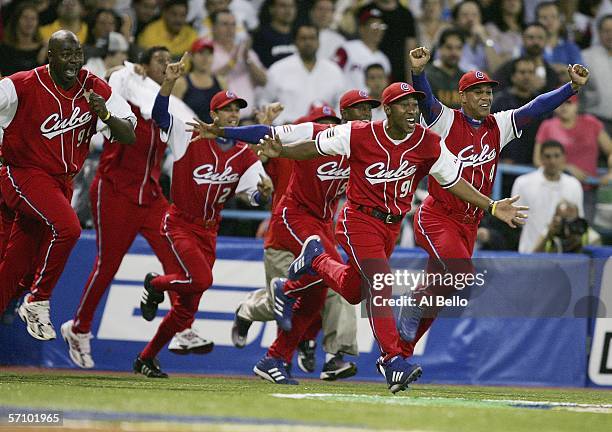 Cuban players celebrate after defeating Puerto Rico 4-3 during Round 2 of the World Baseball Classic on March 15, 2006 at Hiram Bithorn Stadium in...