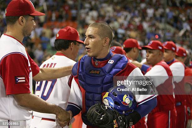 Fernando Cabrera of Puerto Rico shakes hands with Ariel Pestano of Cuba after their game in Round 2 of the World Baseball Classic on March 15, 2006...