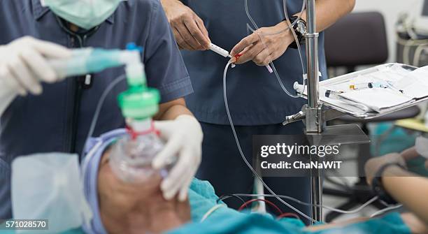 anaesthesiologist injected propofol induction solution for general anaesthesia - general anaesthetic stock pictures, royalty-free photos & images