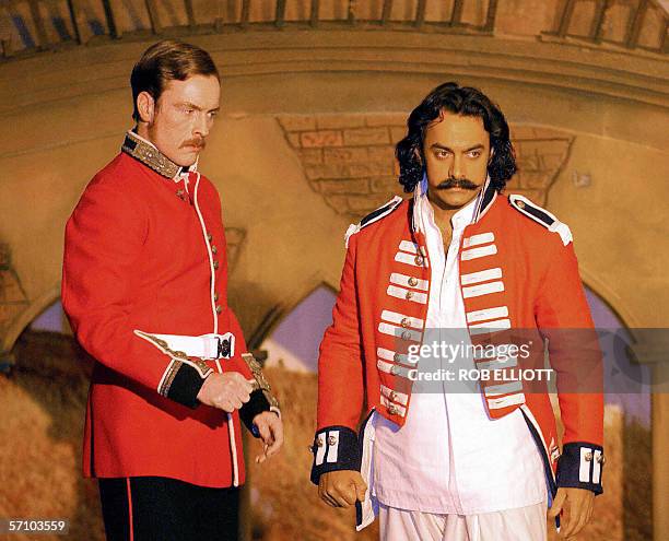 In this picture taken 04 November 2003, Indian actor Aamir Khan , and British actor Toby Stephens rehearse a scene on the set of epic Bollywood drama...