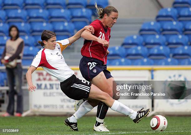 Annike Krahn of Germany and Abby Wanbach of USA vie for the ball during the Womens Algarve Cup match between Germany and USA on March 15, 2006 in...
