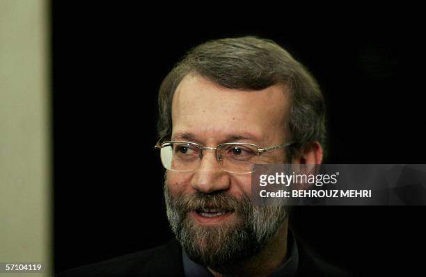 The head of Iran's Supreme National Security Council Ali Larijani speaks to the media during a press conference before his closed session with...