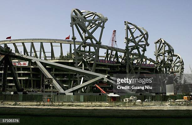 Chinese labourers work on the construction site of the National Olympic Stadium on March 16, 2006 in Beijing, China. The main body of the 2008...
