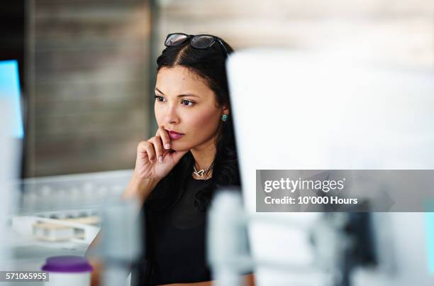 architect at workstation contemplating the project - name tag stock-fotos und bilder