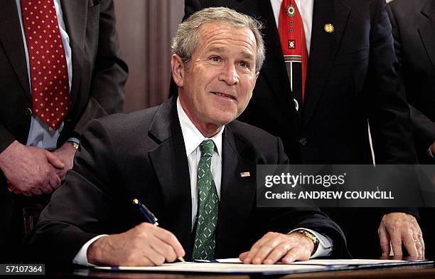Washington, UNITED STATES: US President, George W. Bush signs the Stop Counterfeiting in Manufactured Goods Act in the Eisehower Executive Office...