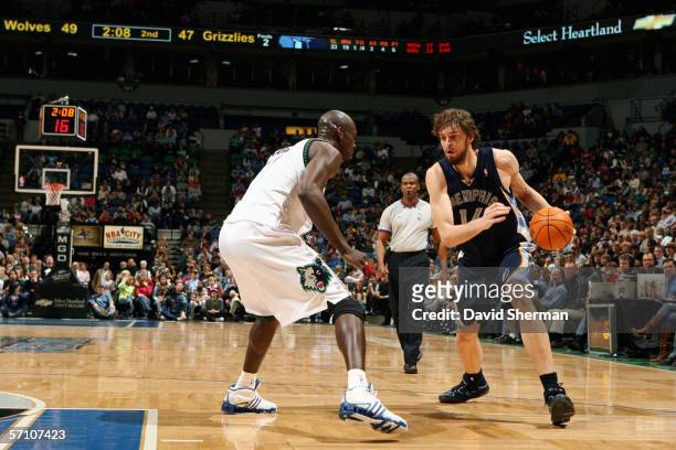 Pau Gasol of the Memphis Grizzlies drives against Kevin Garnett of the Minnesota Timberwolves during a game at Target Center on February 26, 2006 in...
