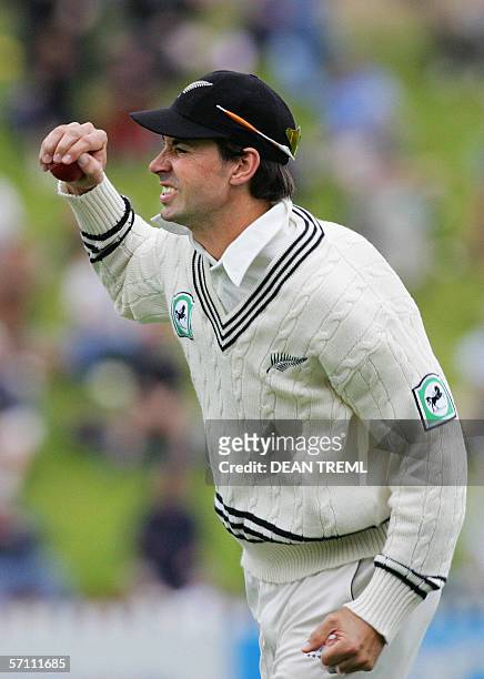 Wellington, NEW ZEALAND: Stephen Fleming of New Zealand catching out Rawl Lewis of the West Indies for 22 during day one of the second Test between...