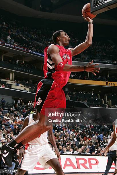 Chris Bosh of the Toronto Raptors shoots against the Charlotte Bobcats during a game at the Charlotte Bobcats Arena on February 10, 2006 in...