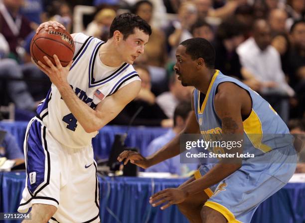 Redick of the Duke Blue Devils is guarded by Alvin Mott of the Southern University Jaguars during the First Round of the 2006 NCAA Men's Basketball...