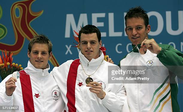 Liam Tancock of England Matthew Clay of England and Johannes Zanberg of South Africa poses with their medal after the men's 50m backstroke final...