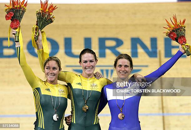 Australia's Katherin Bates celebrates winning gold with silver medallist and compatriot Rochelle Gilmore and Scotland's bronze medallist Kate Cullen...