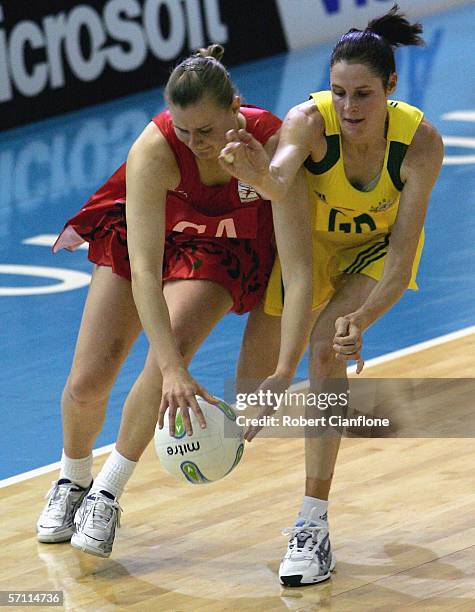Rebecca James of Wales is challenged by Janine Ilitch of Australia during the netball match between Australia and Wales, on Day Two of the 18th...