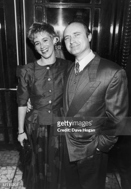 British actor and singer Phil Collins arrives at the Dominion Theatre in London for the Brit Awards, with his second wife, Jill Tavelman, 18th...