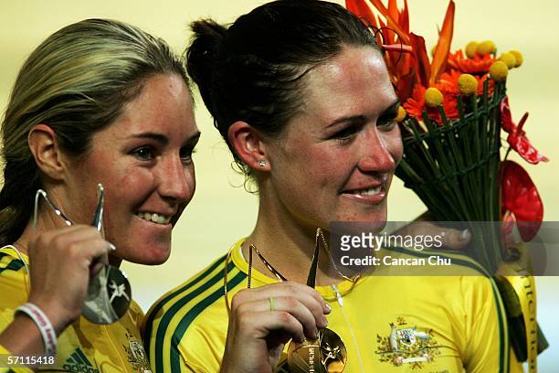 Silver medal winner Rochelle Gilmore of Australia and gold medal winner Katherin Bates of Australia pose on the podium after the Women's Point Race...